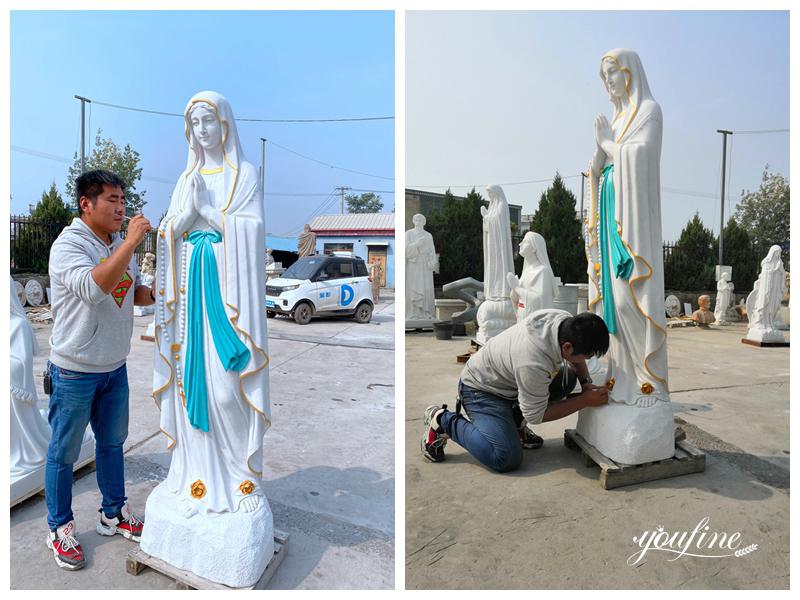 marble statue of Mary holding Jesus