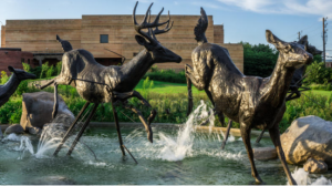 bronze deer statue in zoo